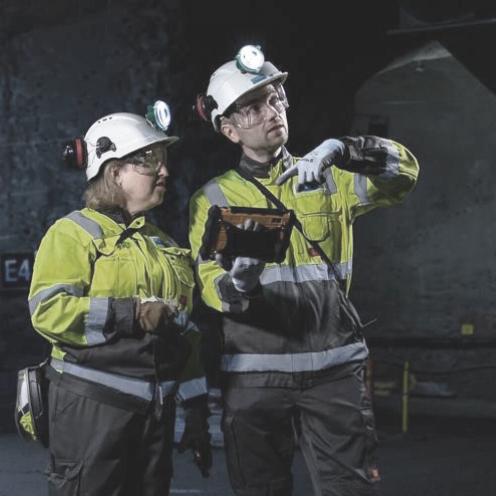 Men using LTE communications in mining